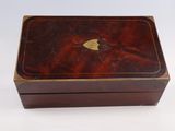 an old wooden box with a heart on the lid