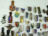 many different types of badges on the wall