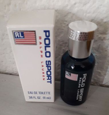 an image of a bottle of cologne next to a box