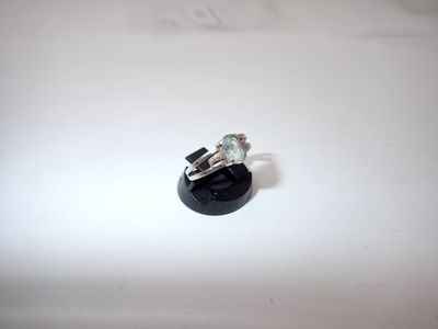 a ring that is sitting on top of a black object