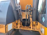 an image of a machine that is parked on the street
