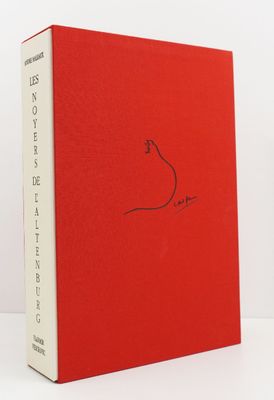 a red book with a drawing of a bird on it