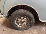 a close up of a truck with a flat tire