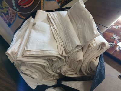 a pile of folded towels sitting on top of a table