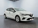 a white car in a white room with a black floor
