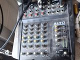 a table with a bunch of electronic equipment on top of it