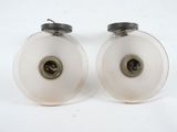 two white rollers that are sitting on a white surface