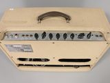 a close up of a guitar amplifier in a case