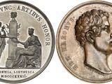 four different types of coins are shown on a white background