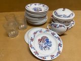 many plates and cups sitting on a table