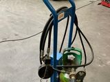 a blue cart with a gas cylinder on it in a warehouse