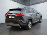 the rear end of a gray toyota rav parked in a garage