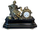a statue of a man sitting on a chair with a clock