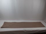 a bed with a sheet on top of it in a room