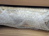 a bag of plastic wrap sitting in a cardboard box