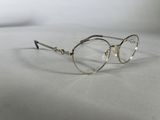 a close up of a pair of glasses on a white surface