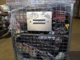 a cart with a lot of shoes on it in a warehouse