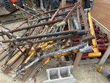 a pile of construction equipment that is sitting on the ground