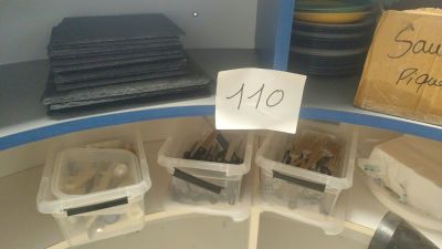 a lot of plastic containers that are sitting on a shelf