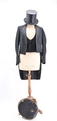 a mannequin with a top hat and a suit on it