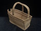 a close up of a wicker basket on a black background