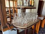 a bar with a lot of wine glasses on top of it