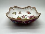 a close up of a bowl on a table with a white background