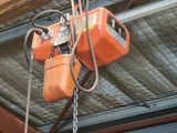 a crane that is hanging from the ceiling of a building