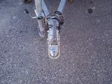 a close up of a bicycle with a chain attached to it