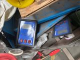 a picture of a tablet computer sitting on top of a pile of tools