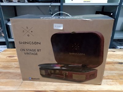 a box that has a suitcase inside of it on a table