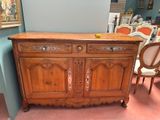 a large wooden cabinet with two doors and two drawers