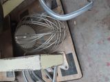 a whisk and a whisk on the floor next to a piece of wood