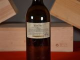 a bottle of wine that is sitting on a table