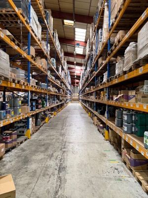 shelves in a warehouse with boxes and boxes on them