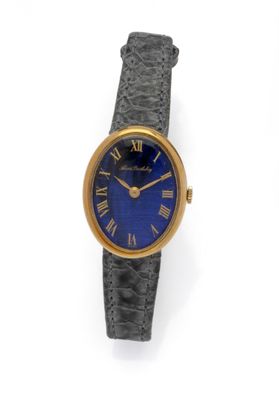 a close up of a wrist watch with roman numerals on it