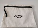 a close up of a white bag with a logo on it