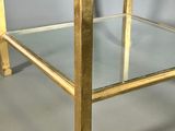 gold metal and glass side table with a glass top