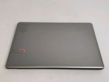 a laptop that is sitting on a white surface