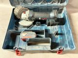 a tool box with tools inside of it on a table