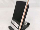 a cell phone that is sitting on a stand