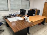 a desk with a computer and a monitor on it