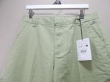 the pants are green and have a white tag on them
