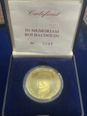 an image of a gold coin in a case
