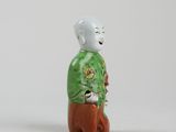 an image of a figurine of a man with a bird on his shoulder