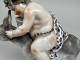 a figurine of a man riding a donkey