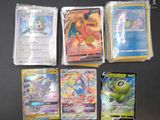 several pokemon cards are lined up on a black surface
