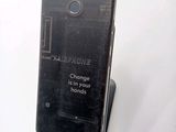 a black cell phone that has a message on it