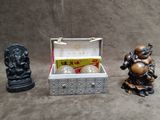 three figurines that are sitting next to each other