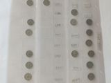 a lot of coins in a plastic bag on a table
